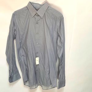 No pocket - interesting circle pattern - hidden buttoned collar